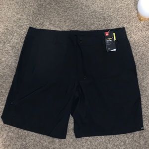 Under Armour golf shorts.